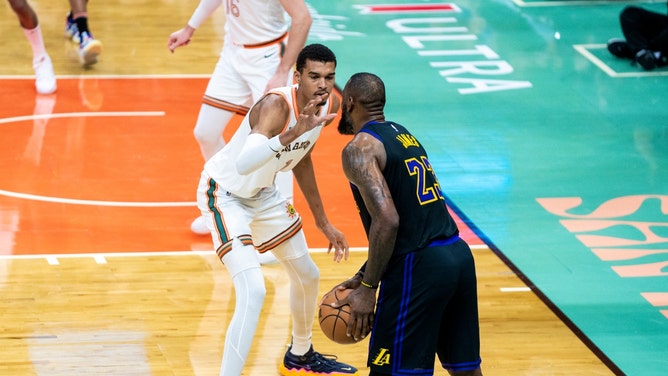 LeBron James in the corner with San Antonio Spurs big Victor Wembanyama playing defense at the Frost Bank Center in Texas. (Tyler Ross/NBAE via Getty Images)
