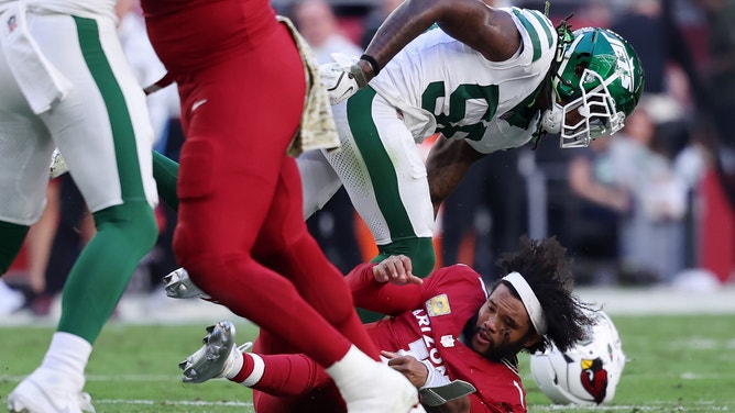 Arizona Cardinals quarterback Kyler Murray took a massive blindside hit from New York Jets defender Quincy Williams and Murray's helmet flew off of his head.