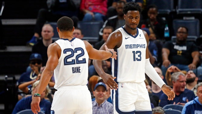 Memphis Grizzlies SG Desmond Bane daps up PF Jaren Jackson Jr. vs. the Brooklyn Nets at FedExForum. (Petre Thomas-Imagn Images)