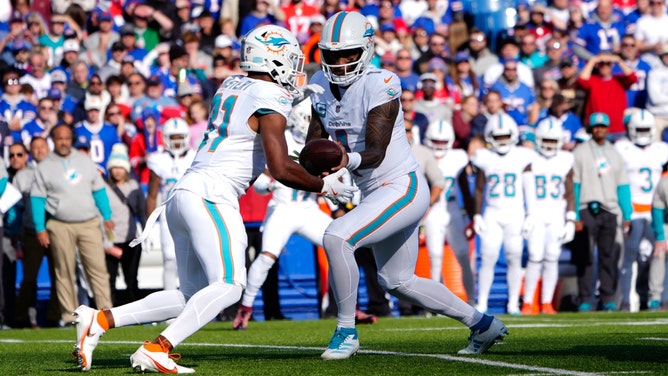 Miami Dolphins QB Tua Tagovailoa hands the ball off to RB Raheem Mostert vs. the Buffalo Bills at Highmark Stadium in NFL Week 9. (Gregory Fisher-Imagn Images)