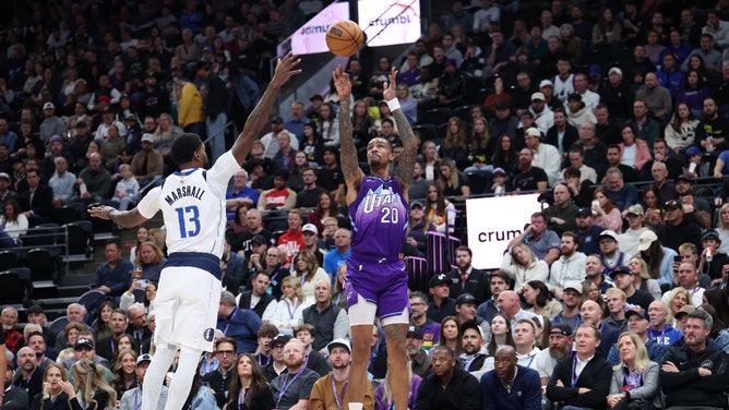 Utah Jazz PF John Collins shoots a 3-pointer vs. the Dallas Mavericks at Delta Center. (Rob Gray-Imagn Images)