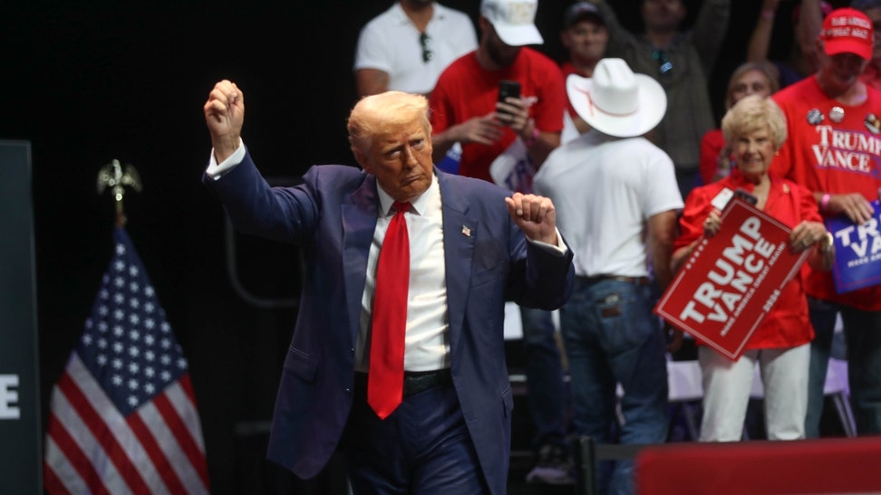 President-elect Donald Trump dances on-stage at the Johnny Mercer Theater after winning the 2024 U.S. election. (Richard Burkhart/USA Today / USA TODAY NETWORK via Imagn Images)