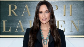 Country music singer Kacey Musgraves was grabbed by a fan during a show in Tampa, Florida. Watch the troubling video. (Credit: Getty Images)