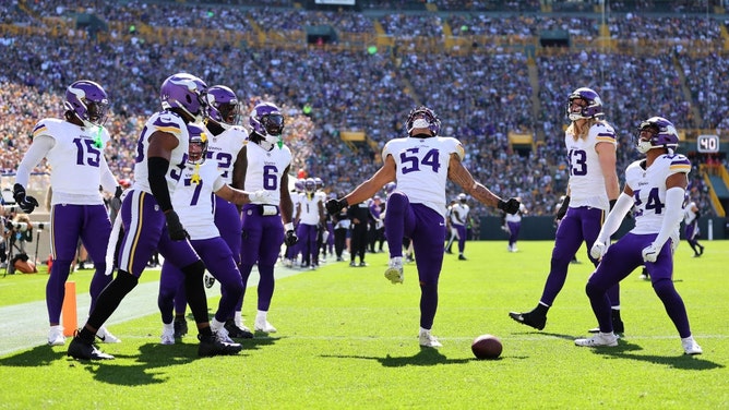 The Minnesota Vikings celebrate an interception of the Green Bay Packers QB Jordan Love at Lambeau Field in NFL Week 4. (Photo by Stacy Revere/Getty Images)
