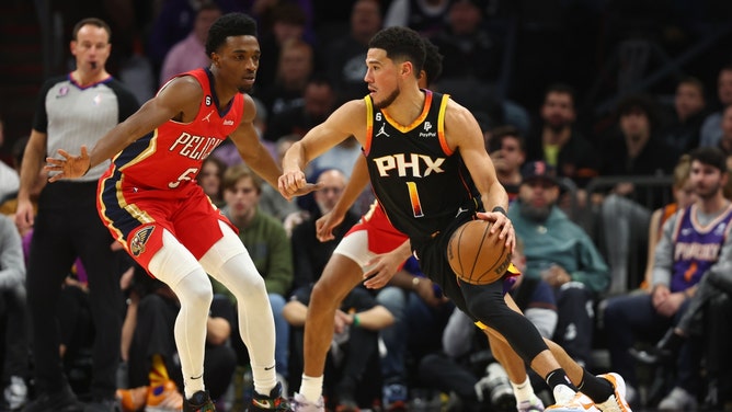 New Orleans Pelicans with Herbert Jones defending Phoenix Suns SG Devin Booker at Footprint Center in Arizona. (Mark J. Rebilas-Imagn Images)
