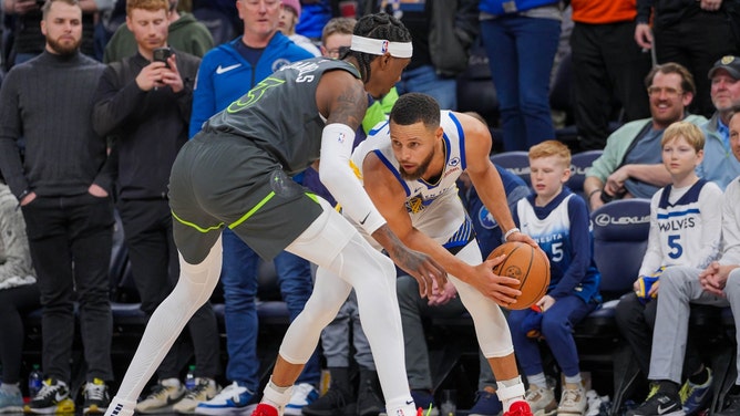 Minnesota Timberwolves SF Jaden McDaniels defends Golden State Warriors All-Star Steph Curry at Target Center. (Brad Rempel-USA TODAY Sports)