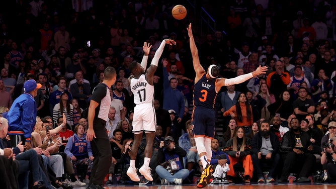 New York Knicks wing Josh Hart closes out on a Brooklyn Nets SG Dennis Schroder 3-pointer in the 2024 Emirates NBA Cup at Madison Square Garden. (Brad Penner-Imagn Images)