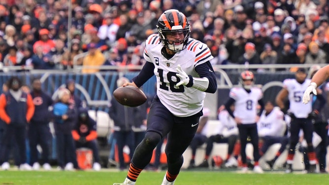 Chicago Bears QB Caleb Williams scrambles away from the Minnesota Vikings at Soldier Field. (Daniel Bartel-Imagn Images)