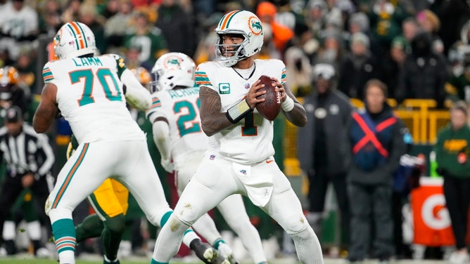 Miami Dolphins QB Tua Tagovailoa drops back to pass against the Green Bay Packers at Lambeau Field Thanksgiving in NFL Week 13. (Jeff Hanisch-Imagn Images)
