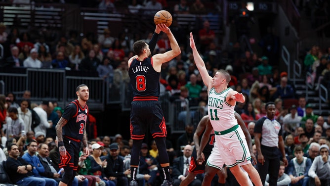 Chicago Bulls SG Zach LaVine shoots a 3-pointer over Boston Celtics PG Payton Pritchard in a 2024 Emirates NBA Cup game at United Center. (Kamil Krzaczynski-Imagn Images)