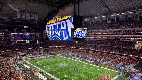 Texas and Ohio State fans enjoy the CFP Cotton Bowl on Friday night. Via: Trey Wallace