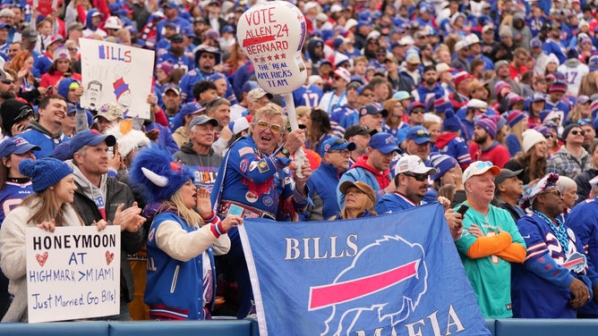 bills fans caught cheating on their spouses in bathroom at game