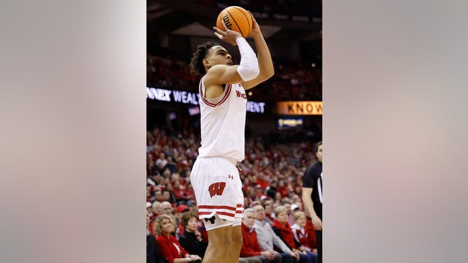 MADISON, WISCONSIN - JANUARY 14: John Tonje #9 of the Wisconsin Badgers makes a three point shot during the second half of the game against the Ohio State Buckeyes at Kohl Center on January 14, 2025 in Madison, Wisconsin. (Photo by John Fisher/Getty Images)