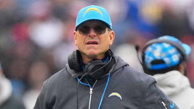 Los Angeles Chargers head coach Jim Harbaugh looks on from the sidelines during the first half against the New England Patriots at Gillette Stadium.