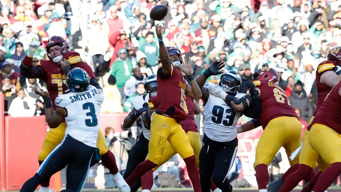 Washington Commanders QB Jayden Daniels throws the ball out of his end zone vs. the Philadelphia Eagles in NFL Week 11. (Photo credit: Geoff Burke-Imagn Images)