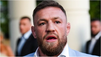 Conor McGregor was caught on video in a heated altercation with a UFC fan at the Wynn in Las Vegas. He denied spitting on him after claiming he did. Watch the video. (Credit: Getty Images)