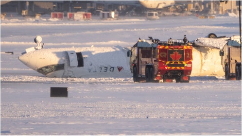A shocking video shows passengers upside down following a plane crash in Toronto. Watch the footage. What happened? (Credit: Getty Images)