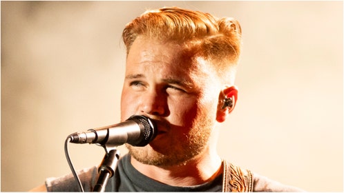 Zach Bryan teased two new songs titled "Skin" and "River Road Drive." Listen to the teases. (Credit: Getty Images)