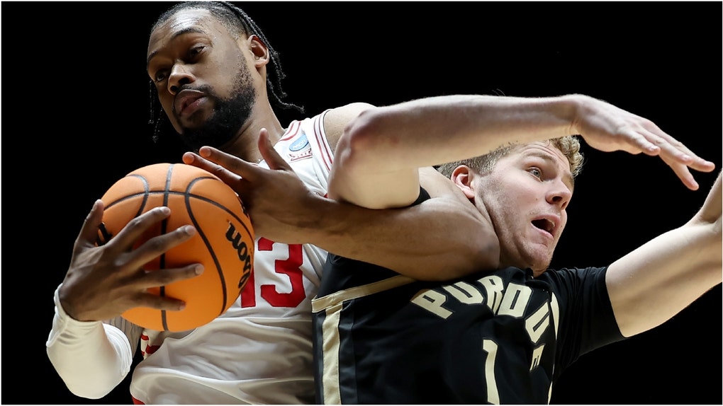 College basketball fans are reacting to no-call on a potential push-off on Houston guard Milos Uzan. Watch a video of the play. Was it a push-off? What are the reactions? (Photo by Gregory Shamus/Getty Images)