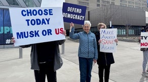Protestors gather outside a luncheon for Kentucky congressman Andy Bar, voicing their displeasure for Donald Trump and Elon Musk Via: Trey Wallace
