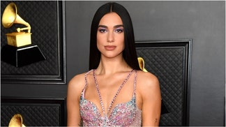 Dua Lipa is going viral for putting her yoga skills on display. Watch her yoga videos. (Photo by Kevin Mazur/Getty Images for The Recording Academy)