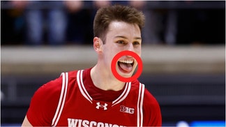 Wisconsin basketball player Jack Janicki lost a tooth at the end of the game against Minnesota. Watch a video of the moment it happened. (Credit: Jeffrey Brown/Icon Sportswire/Getty Images)