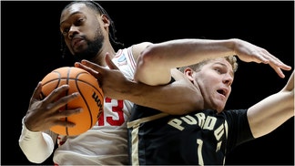 College basketball fans are reacting to no-call on a potential push-off on Houston guard Milos Uzan. Watch a video of the play. Was it a push-off? What are the reactions? (Photo by Gregory Shamus/Getty Images)