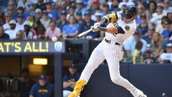Milwaukee Brewers OF Christian Yelich hits a single against the Chicago Cubs at American Family Field. (Photo Credit: Michael McLoone-USA TODAY Sports)