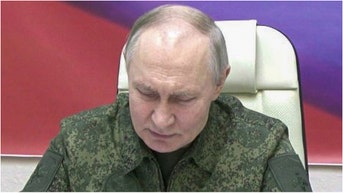 Russian leader Vladimir Putin wore combat fatigues during a visit to Kursk. Check out photos of the visit. (Photo by Kremlin Press Office / Handout/Anadolu via Getty Images)