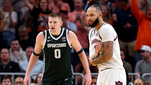 Johni Broome injured his elbow against Michigan State, but did return to the game, grabbing his elbow