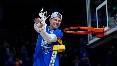 Florida Gators head coach Todd Golden cuts down the nets after beating the Texas Tech Red Raiders in the Elite Eight of the 2025 NCAA Tournament. (Photo Credit: Kyle Terada-Imagn Images)
