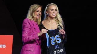 Hailey Van Lith poses with WNBA commissioner Cathy Engelbert after being selected 11th overall by the Chicago Sky in the 2025 WNBA Draft. 