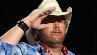 An old video of Toby Keith singing "A Country Boy Can Survive" by Hank Williams Jr. has resurfaced. Watch the video. (Photo by Kevin Winter/ACMA2014/Getty Images for ACM)