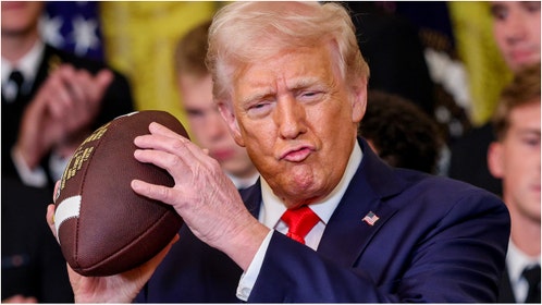 President Donald Trump was caught on video sharing a touching moment with Navy band members at the White House. Watch the video. (Photo by Win McNamee/Getty Images)