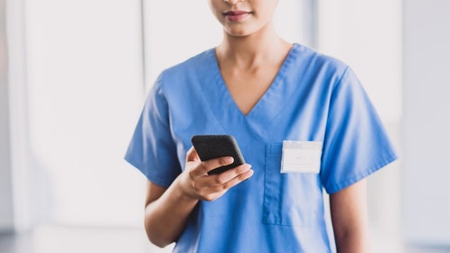 nhs nurse under investigation content in uniform