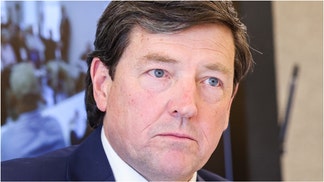 A woman spit on Ed Martin during a live TV interview. (Photo by Valerie Plesch/For The Washington Post)