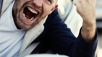 A man gets his ass kicked hanging out of his car's window during a road rage incident in Ohio