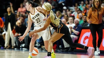 Is this ref calling security on WNBA player Dijonai Carrington fair or foul given her past actions?