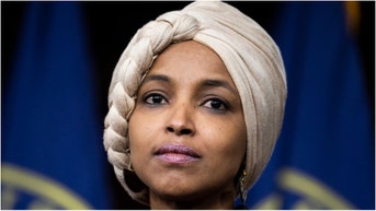 Congresswoman Ilhan Omar doubled down on telling a reporter to "f**k off." Watch a video of her actions. What did she do in response? (Tom Williams/CQ-Roll Call, Inc via Getty Images)