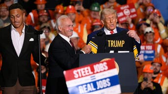 President Donald Trump receives a Pittsburgh Steeler jersey from Rocky Bleier at the US Steel-Irvin Works on May 30, 2025 in West Mifflin, Pennsylvania. 