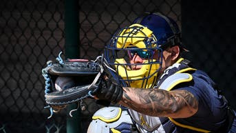 Milwaukee Brewers catcher William Contreras catches in the bullpen during spring training workouts. 