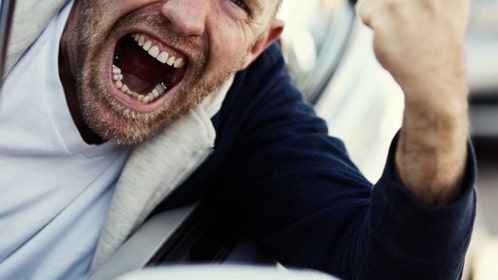 A man gets his ass kicked hanging out of his car's window during a road rage incident in Ohio