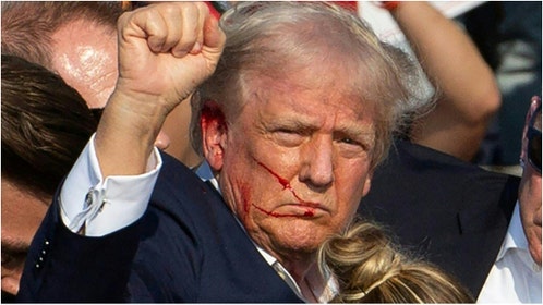 Wajahat Ali appeared to suggest Donald Trump might not have been shot during an appearance on "Piers Morgan Uncensored." Watch a video of the comment. (Photo by REBECCA DROKE/AFP via Getty Images)