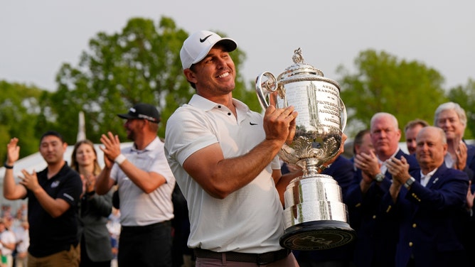 Brooks Koepka holding the Wanamaker Trophy after winning the 2023 PGA Championship at Oak Hill Country Club in Rochester, New York. (Photo Credit: Adam Cairns-USA TODAY Sports)
