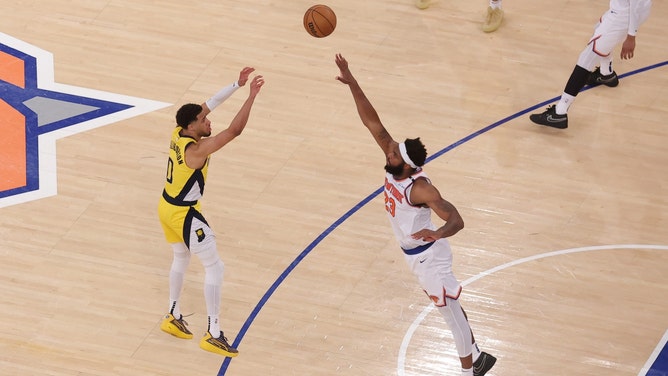 Indiana Pacers PG Tyrese Haliburton putting up a prayer over New York Knicks C Mitchell Robinson as time expires in the fourth quarter of Game 1 in the 2025 Eastern Conference Finals at Madison Square Garden. (Photo Credit: Brad Penner-Imagn Images)