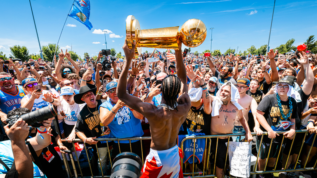 Shai Gilgeous-Alexander holding Larry O'Brien Trophy