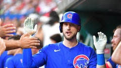 Kyle Tucker celebrates in dugout with Cubs