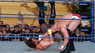 A couple chokeslam a guy during their wedding