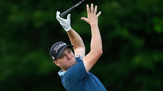 Justin Thomas throws his driver on a teebox