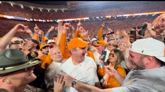 Tennessee head coach Josh Heupel and Grant Frerking celebrate the win over Alabama in 2022